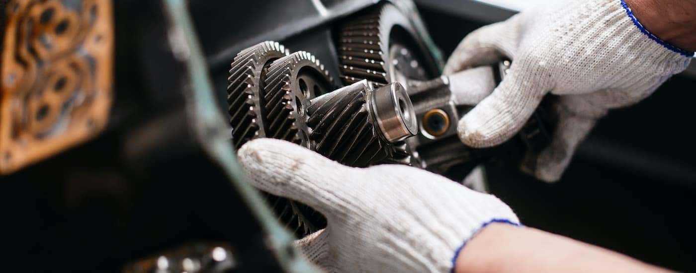 Mechanic inspecting transmission gears